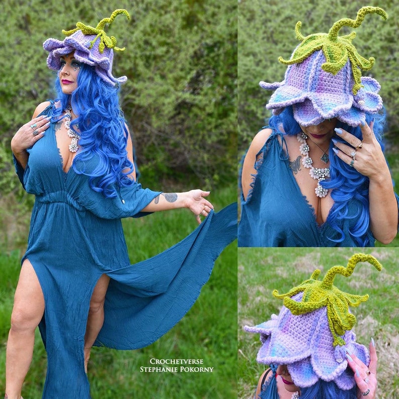 May include: A purple and green crocheted flower hat with a large flower design. The hat is worn by a person with blue hair and a blue dress. The text "CROCHETVERSE STEPHANIE POKORNY" is visible in the image.
