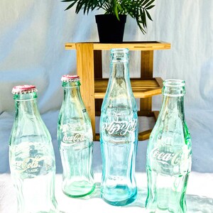 Vintage Turquoise Glass CocaCola Hobble-Skirt Bottles including Hebrew Logo