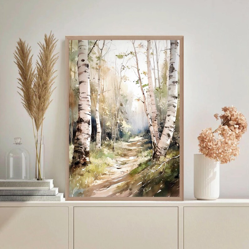 May include: A watercolor painting of a path through a birch forest. The trees are white with black markings and the path is lined with green grass and leaves. The painting has a soft, dreamy feel.