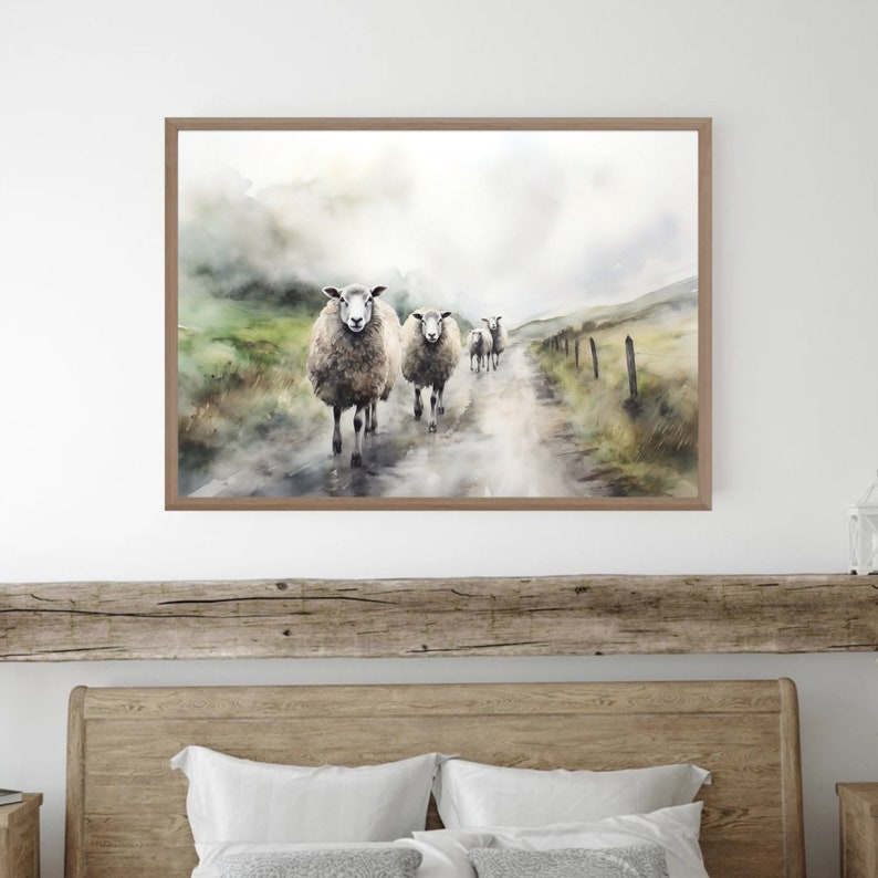 May include: A watercolor painting of a group of sheep walking down a dirt road in a foggy landscape. The sheep are white with brown faces and are walking in a line. The road is surrounded by green grass and trees. The sky is a light blue with white clouds.