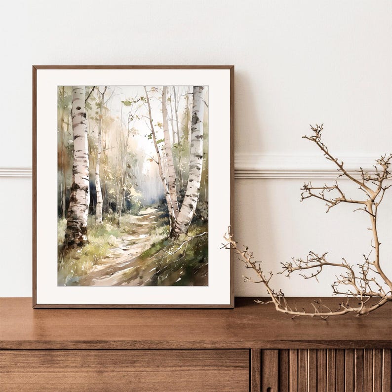 May include: Watercolor painting of a path through a birch forest. The path is lined with tall, white birch trees with green leaves. The painting is framed in a brown wood frame.