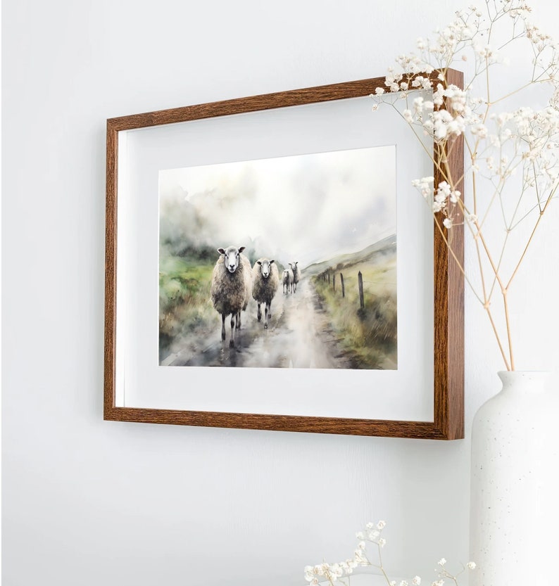 May include: A watercolor painting of a group of sheep walking down a path in a misty landscape. The sheep are white with brown markings and are walking in a line. The path is dirt and the landscape is green and brown.