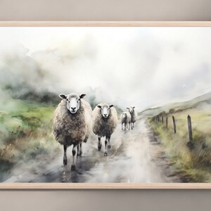 May include: A watercolor painting of a group of sheep walking down a foggy path. The sheep are white with brown faces and are walking in a line. The path is dirt and the background is a misty green and brown landscape.
