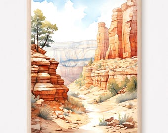 May include: A framed watercolor painting depicting a desert canyon landscape with tall orange rock formations, a sandy path winding through the center, sparse green desert vegetation, and a light blue sky with soft white clouds above the cliffs.