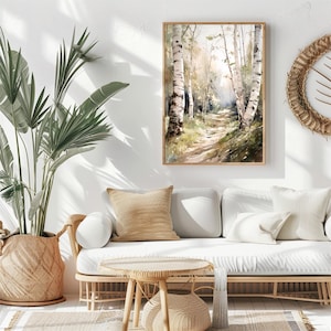May include: A watercolor painting of a path through a birch tree forest. The path is lined with tall, white birch trees with green leaves. The painting is framed in a light wood frame and hangs on a white wall.