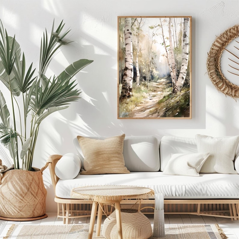 May include: A watercolor painting of a path through a birch tree forest. The path is lined with tall, white birch trees with green leaves. The painting is framed in a light wood frame and hangs on a white wall.