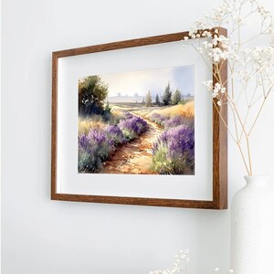 May include: A watercolour painting depicting a path winding through a field of lavender flowers. Trees line the path and the sky is a soft blue.