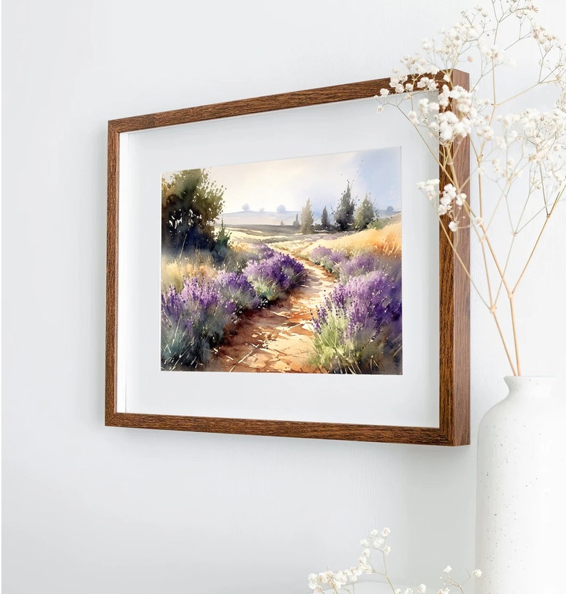 May include: A watercolour painting depicting a path winding through a field of lavender flowers. Trees line the path and the sky is a soft blue.