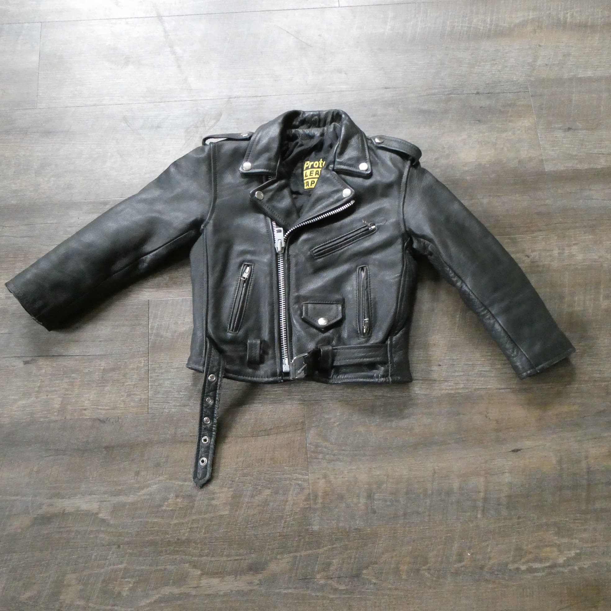 Leather biker jacket with mini monogram print