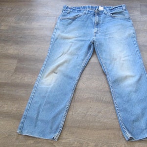 May include: A pair of light blue denim jeans with a straight leg fit.