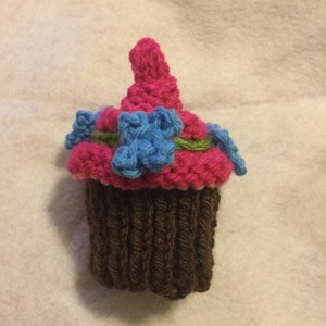 Delicious Knit Cupcake Treat - Chocolate Brown Bottom and Pink Swirls with Blue Flowers