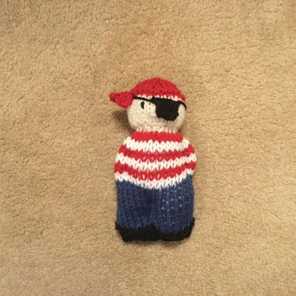 Adorable knit boy pirate doll with red and white stripe shirt, blue pants and eye patch.  Cute!