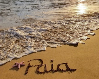 Paia, Maui, Hawaii sunset. Paia written in the sand from Kihei. Donation to the Maui Humane Soc with each purchase. Golden sunset.