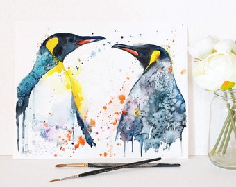 May include: Watercolour painting of two penguins facing each other. The penguins are painted in shades of blue, yellow, and black. The background is a white wash with splashes of orange and purple.