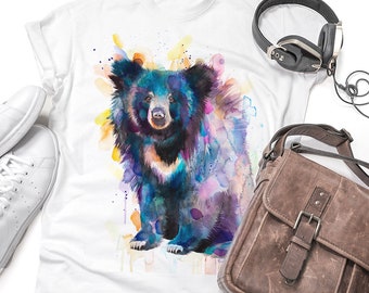 May include: White t-shirt with a watercolor illustration of a black bear with blue, purple, and pink accents. The bear is sitting on a white background with yellow and orange splatters.