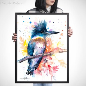 May include: Watercolor painting of a blue, purple, and brown kingfisher perched on a branch with colorful flowers and leaves. The background is white with scattered blue, pink, and red dots.