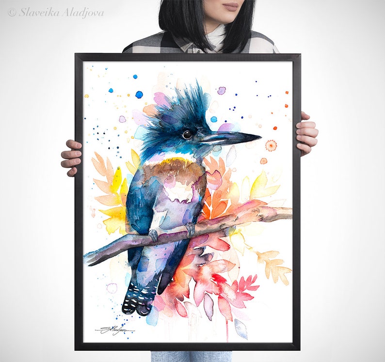 May include: Watercolor painting of a blue, purple, and brown kingfisher perched on a branch with colorful flowers and leaves. The background is white with scattered blue, pink, and red dots.