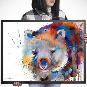 May include: Watercolor painting of a wombat with a colorful background. The wombat is painted in shades of brown, gray, and white, with a blue nose and pink tongue. The background is a mix of blue, purple, orange, and red.