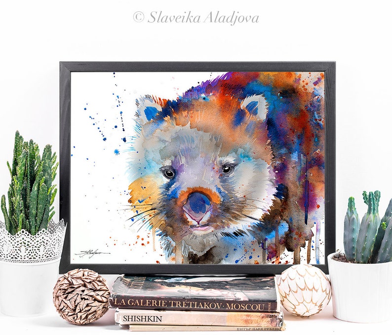 May include: Watercolor painting of a wombat with a blue, orange, and purple background. The wombat is looking directly at the viewer with a cute expression.