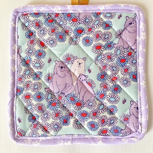 May include: A set of three ceramic mugs with a speckled, matte finish. The mugs are in shades of cream, light gray, and dark gray. Each mug has a simple, minimalist design, perfect for coffee or tea.