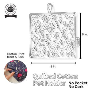 May include: A square, quilted cotton pot holder with a black and white floral and bird design. The pot holder is 8 inches by 8 inches and has a loop for hanging. The text "Quilted Cotton Pot Holder" is displayed.