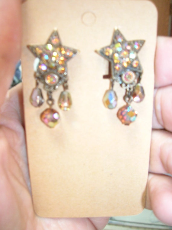 Kirks Folly coppertone star earrings with AB topaz