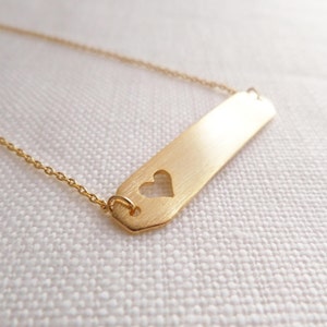 gold bar necklace with hollow out heart