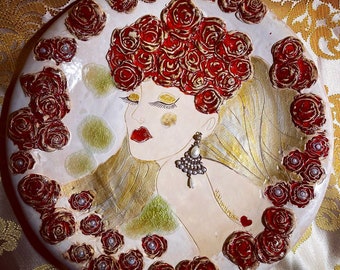 Handmade ceramics plate with red roses and women.