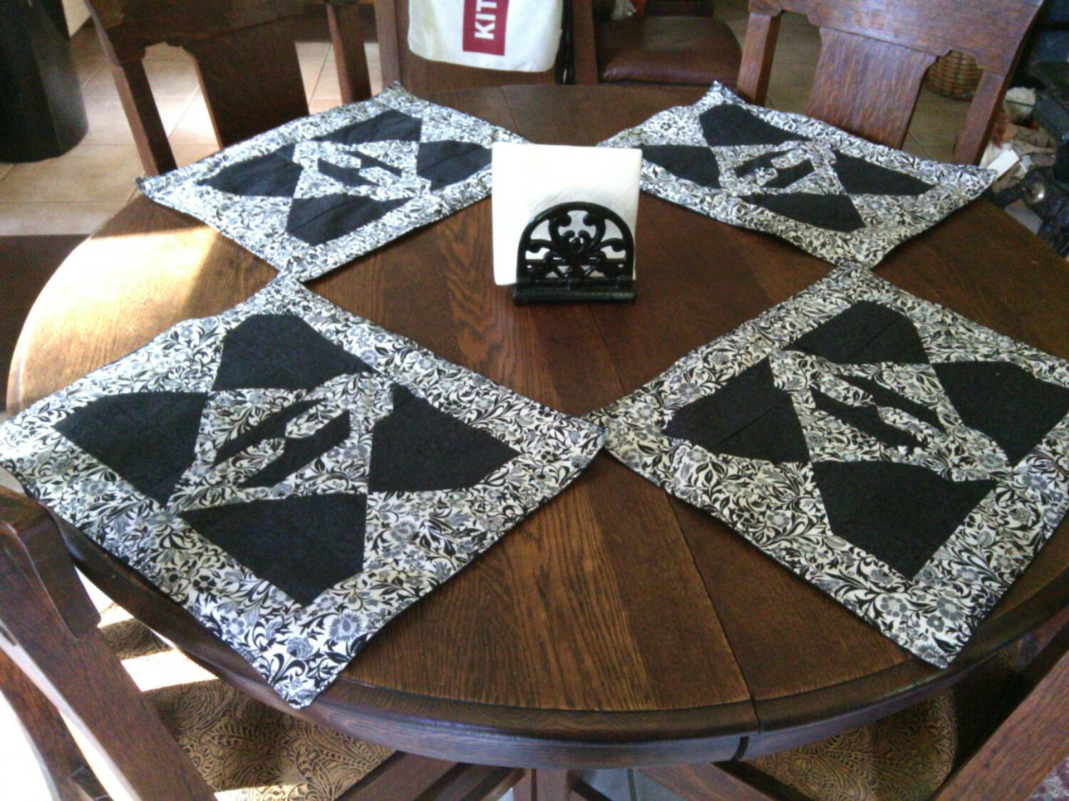 Handmade set of 4 quilted placemats in black & white.