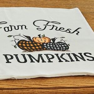 18x18 inch canvas pillow cover hidden zipper reads farm fresh pumpkins with 3 pumpkins on it two of them are buffalo plaid image is permanently embedded into the fibers of the fabric and will never come off machine wash tumble dry pillow cover only
