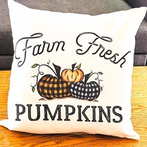 18x18 inch canvas pillow cover hidden zipper reads farm fresh pumpkins with 3 pumpkins on it two of them are buffalo plaid image is permanently embedded into the fibers of the fabric and will never come off machine wash tumble dry pillow cover only