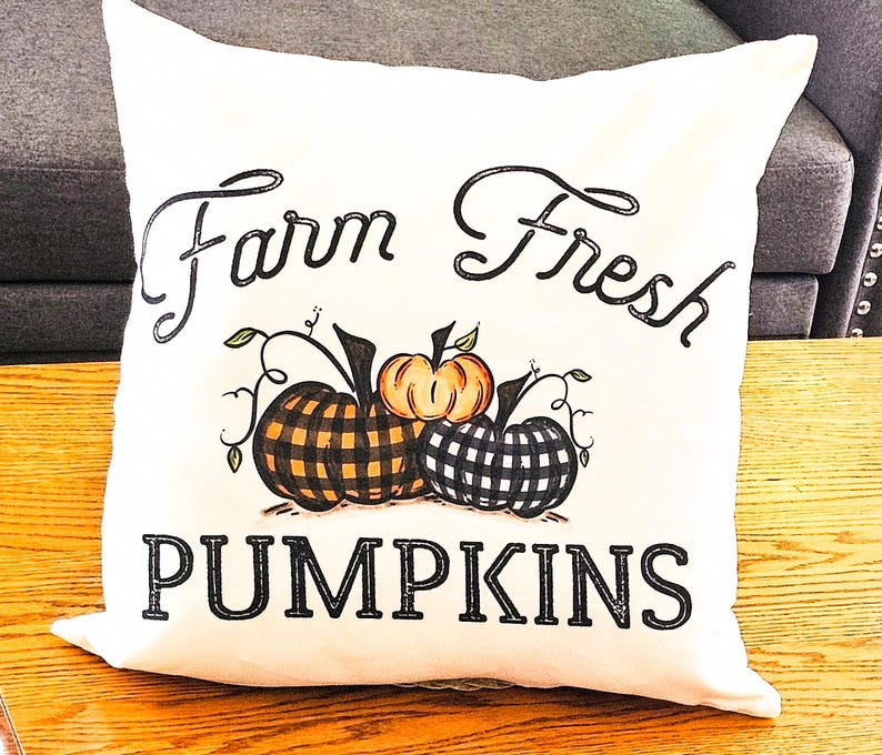 18x18 inch canvas pillow cover hidden zipper reads farm fresh pumpkins with 3 pumpkins on it two of them are buffalo plaid image is permanently embedded into the fibers of the fabric and will never come off machine wash tumble dry pillow cover only