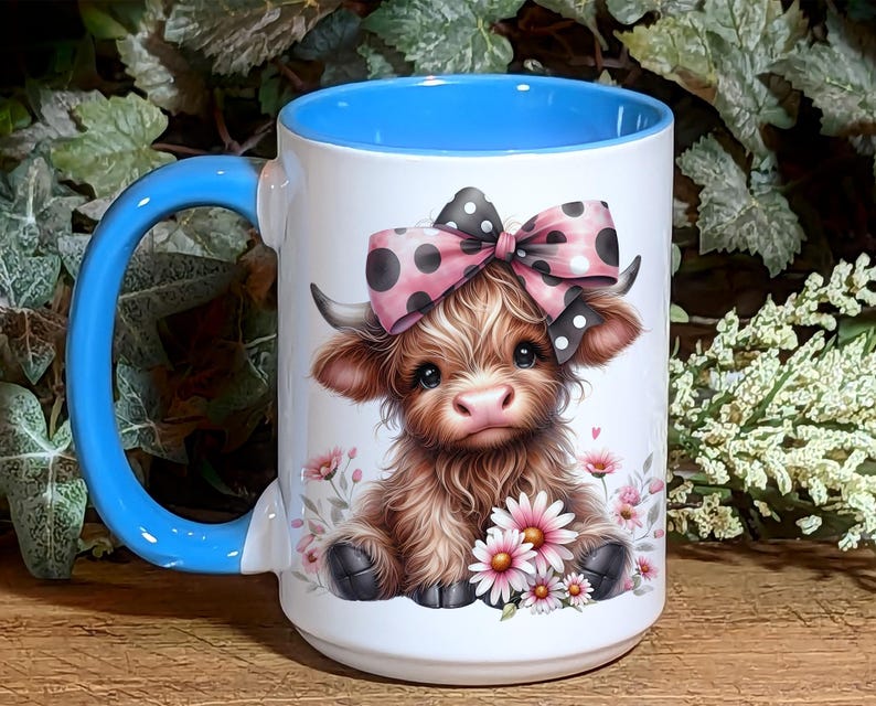 A beautifully designed personalized Highland Cow mug featuring an adorable brown cow with a pink and black polka dot bow, surrounded by soft pink flowers. This 15-ounce ceramic mug is available with a black, white, or blue handle.