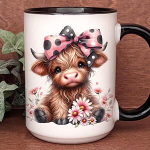 A beautifully designed personalized Highland Cow mug featuring an adorable brown cow with a pink and black polka dot bow, surrounded by soft pink flowers. This 15-ounce ceramic mug is available with a black, white, or blue handle.