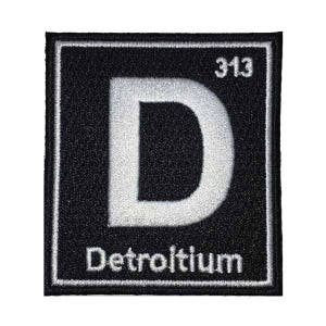 May include: Black and white embroidered patch with a white letter "D" and the text "Detroitium" and the number "313" above the letter.