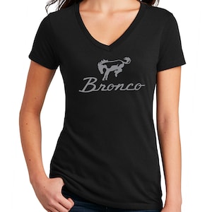 May include: Black v-neck t-shirt with a gray silhouette of a horse and the word "Bronco" in a cursive font.