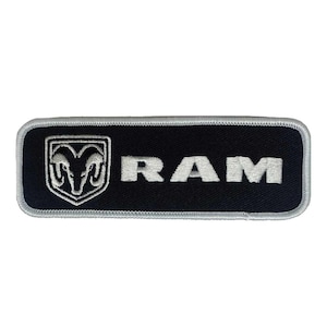 May include: A black and silver embroidered patch with the word "RAM" and a silver ram's head logo.