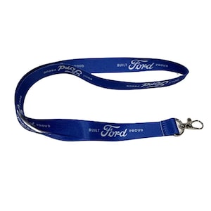 May include: A blue lanyard with a silver clip. The lanyard has the text "Built Ford Proud" repeated on both sides.