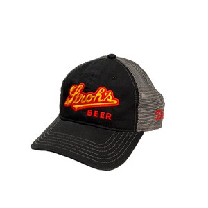 May include: A black and gray trucker hat with a red and yellow embroidered logo that says "Stroh's Beer".