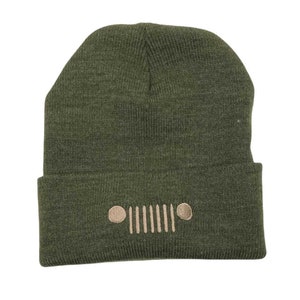 May include: A green knitted beanie with a brown embroidered Jeep logo.