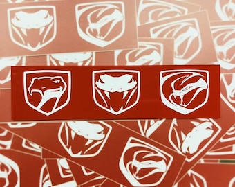 May include: White Viper logo stickers on a red background. The stickers feature a stylized snake head within a shield shape. The image shows multiple stickers, some individual and some in a strip of three.