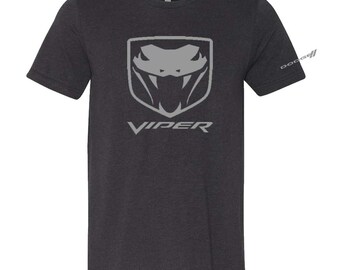 May include: A dark grey t-shirt featuring a grey Dodge Viper logo and the word "VIPER" printed on the front.