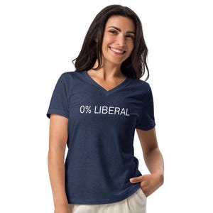 May include: A navy blue v-neck t-shirt with the text "0% LIBERAL" in white. The shirt is made of a soft material and is suitable for casual wear.
