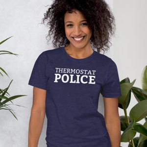 May include: A navy blue t-shirt with white text that reads "Thermostat Police".