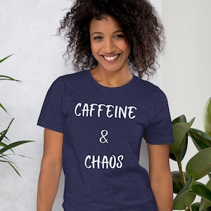 May include: A navy blue t-shirt with white text that reads "CAFFEINE & CHAOS".