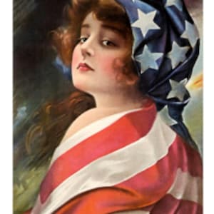 May include: A woman with long brown hair is draped in an American flag. She is wearing a blue and white headband with stars. The woman is looking down and to the left.