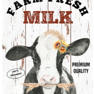 May include: A black and white cow with a sunflower headband is holding a stalk of wheat in its mouth. The background is a whitewashed wooden plank wall with the text "Farm Fresh Milk" in red and black letters. The text "100% Organic" is in a circle and the text "Premium Quality" is in a rectangle.