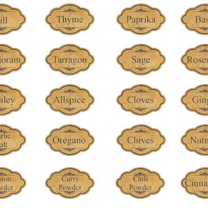 May include: Set of 16 brown oval spice jar labels with black text. The labels include common spices such as dill, thyme, paprika, basil, marjoram, tarragon, sage, rosemary, parsley, allspice, cloves, ginger, garlic salt, oregano, chives, nutmeg, onion powder, curry powder, chili powder, and cinnamon.