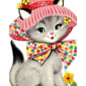 May include: A gray kitten wearing a pink and white striped hat with colorful flowers and a matching bow. The kitten is sitting on a white background.