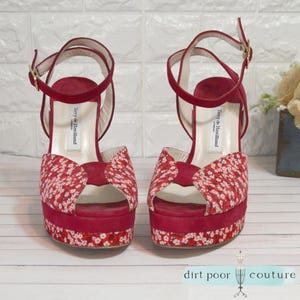 designer glam heels
terry de havilland
70s style platforms
vintage red heels
chunky heel vintage
rare velvet heels
retro peep toe shoe
red ankle strap heel
designer shoe
velvet platforms
peep toe shoes
floral heels
collector fashion